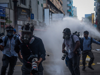 Riot police use water cannons and teargas to dissolve photojournalist's and Video journalist's ongoing protest in Colombo, Sri Lanka January...