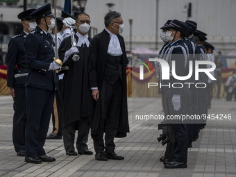 Hong Kong Chief Justice, Andrew Cheung Kui-nung escorted by a police officer inspecting a Ceremonial Guard during the Ceremonial Opening of...