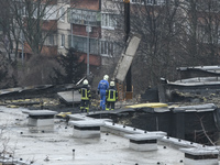 Rescuers work at the site of a helicopter crash near kindergarten,  in the Brovary town, in the outskirts of Kyiv, Ukraine, January 18, 2023...