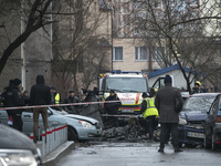 Experts and criminologists work at the site of a helicopter crash near kindergarten,  in the Brovary town, in the outskirts of Kyiv, Ukraine...
