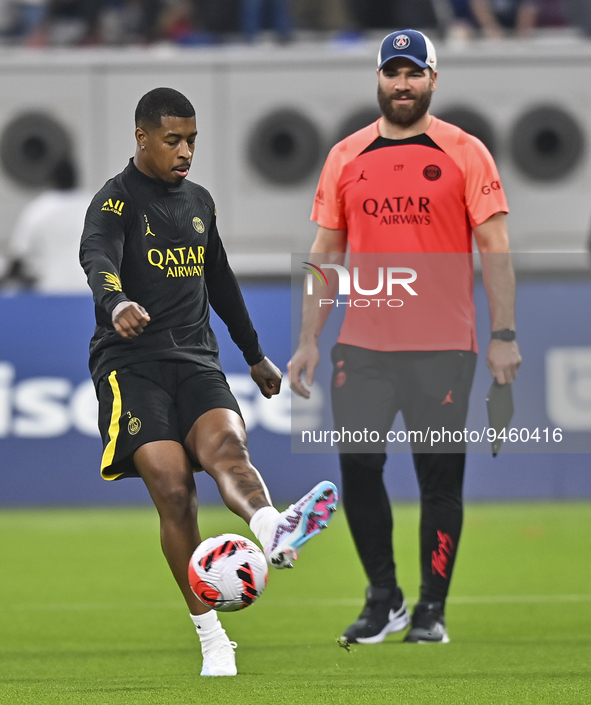 Paris Saint-Germain's Presnel Kimpembe (L) attends a team training session at Khalifa International Stadium in Doha ,Qatar on 18 January 202...