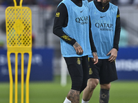 Paris Saint-Germain's  Lionel Messi (R) and Neymar Jr (L) attend a team training session at Khalifa International Stadium in Doha ,Qatar on...