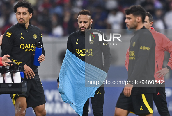 Paris Saint-Germain's Neymar Jr (C) and Marquinhos (L) attend a team training session at Khalifa International Stadium in Doha ,Qatar on 18...