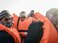Migrants approach the coast of the northeastern Greek island of Lesbos on Thursday, Dec. 6, 2015. About 5,000 migrants are reaching Europe e...