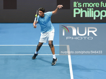 MANILA, Philippines - Australia’s Mark Philippoussis playing for the Philippine Mavericks returns the shot during his match against Croatia’...