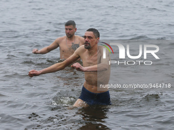 Ukrainians take a dip in icy water during celebration of the Orthodox Epiphany Christian feast in Dnipro River of Kyiv, Ukraine 19 January 2...
