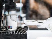Robox coffee machine is seen making a cup of coffee at a point on a platform of the train station in Warsaw, Poland on January 19, 2023. A m...