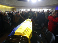 Ukrainians take part at a farewell ceremony for Ukrainian Internal Affairs Minister Denys Monastyrsky, first Deputy Minister Yevhenii Yenin,...