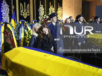 Relatives react during a farewell ceremony for Ukrainian Internal Affairs Minister Denys Monastyrsky, first Deputy Minister Yevhenii Yenin,...