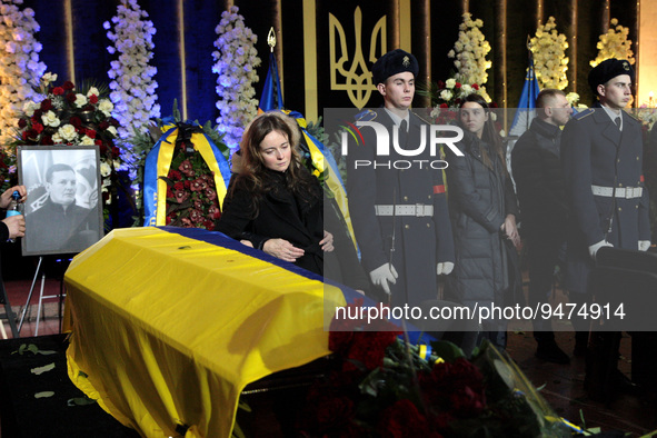 KYIV, UKRAINE - JANUARY 21, 2023 - Relatives mourn late First Deputy Minister of Internal Affairs of Ukraine Yevhenii Yenin during the lying...