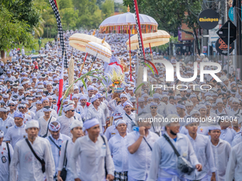 Tens of thousands of people from Jimbaran village embark on a pilgrimage to Uluwatu Temple to perform the ''Ngiring Ida Sesuhunan Dewa Ayu''...