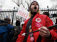 A man beats on drums before being assaulted by an anti-abortion rights demonstrator outside of the White House during the Women's March in W...