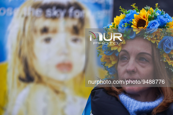 Ukrainian woman attends a demonstration of solidarity with Ukraine while celebrating Ukrainian Unity Day on day 333 of Russian invasion on U...