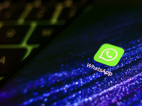 WhatsApp app logo is displayed on a mobile phone screen for illustration photo. Krakow, Poland on January 23, 2023. (