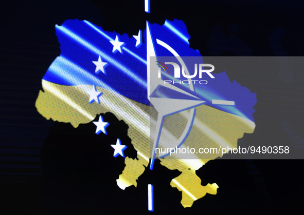 A map of Ukraine is seen through fragments of the NATO and the EU flags during the Kyiv Security Forum in Kyiv, Ukraine 23 January 2023, ami...