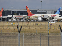 Air India Boeing 787 Dreamliner aircraft as seen at the gates of the terminal of London Heathrow airport during a cloudy day from  Myrtle Av...