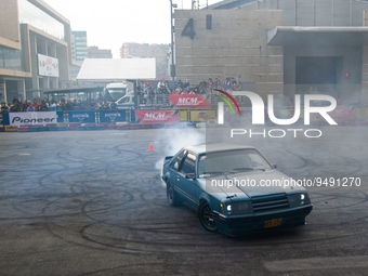 A Ford Mustang performs a drift and burnout show during the MCM Car Show in Bogota, Colombia, the biggest auto show in latin america, on Jan...