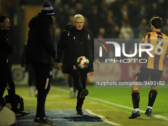Bradford manager Mark Hughes controls the ball during the Sky Bet League 2 match between Stockport County and Bradford City at the Edgeley P...