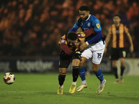 Bradfords Abo Eisa clashes with Stockports Ryan Johnson during the Sky Bet League 2 match between Stockport County and Bradford City at the...