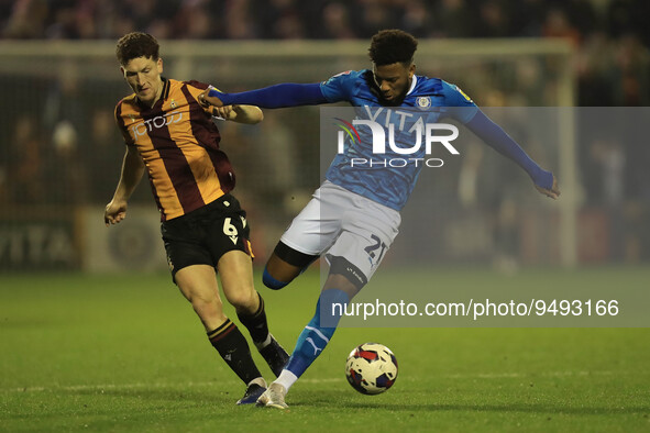 Stockports Myles Hippolyte holds off Bradfords Richie Smallwood during the Sky Bet League 2 match between Stockport County and Bradford City...
