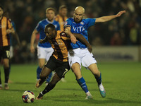 Stockports Paddy Madden battles with Bradfords Tolaji Bola during the Sky Bet League 2 match between Stockport County and Bradford City at t...