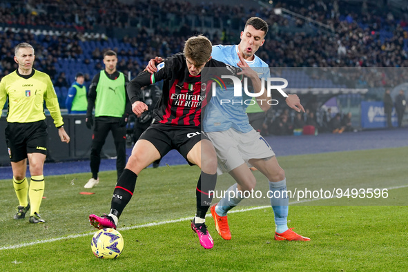 Charles De Ketelaere of AC Milan and Nicolo' Casale of SS Lazio compete for the ball during the Serie A match between SS Lazio and AC Milan...