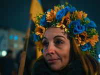 A protester wearing a wreath on the head in Ukrainian colors is seen during the 'Protest in Support of Ukraine' on the Main Market Square in...