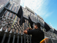 A group of employees of the Central Bank of Sri Lanka protested by raising black flags saying that the tax paid has been unfairly increased...
