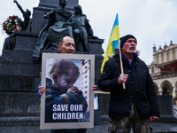 Ukrainian citizens and supporters attend a demonstration of solidarity with Ukraine at the Main Square on day 336 of Russian invasion on Ukr...