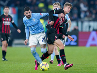 Elseid Hysaj of SS Lazio and Charles De Ketelaere of AC Milan compete for the ball during the Serie A match between SS Lazio and AC Milan at...