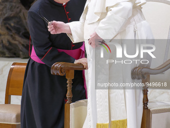 Pope Francis talks with Mons. Leonardo Sapienza (L) at the end of his weekly general audience in the Pope Paul VI hall at the Vatican, Wedne...