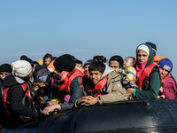 Refugees and migrants arrive on a dingy from the Turkish coast to the northeastern Greek island of Lesbos Dec. 8, 2015. (