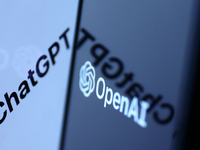 ChatGPT sign in the website displayed on a laptop screen and OpenAI logo displayed on a phone screen are seen in this illustration photo tak...
