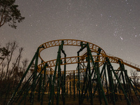Roller coaster under the starry sky. Due to Russian aggression, a city 30 km from the border is forced to turn off the street lights. The ab...