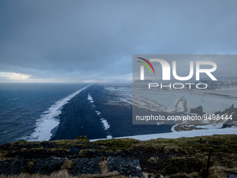 A view of Black Beach from the Dyrhólaey Peninsula, in Dyrhólaey, Iceland, on January 24, 2023. -Dyrhólaey Peninsula, a 120-meter-long prome...