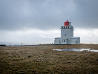 A view of the lighthouse from the Dyrhólaey Peninsula, in Dyrhólaey, Iceland, on January 24, 2023. -Dyrhólaey Peninsula, a 120-meter-long pr...