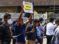 An employees of the Central Bank of Sri Lanka protest,  they  saying that the tax paid has been unfairly increased in front of the Central B...