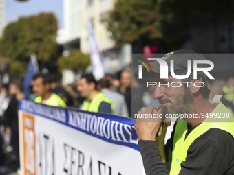 A worker takes part in a protest outside the city administration building in Limassol. Cyprus, Thursday, January 26, 2023. Thousands of work...