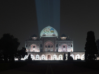 Humayun's tomb is seen lit up with G20 logo, in New Delhi on December 3, 2022. Many monuments, including UNESCO world heritage sites across...
