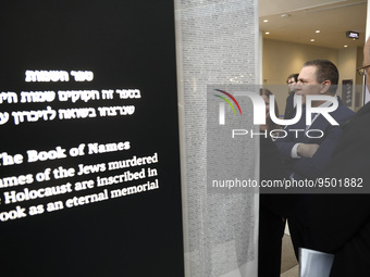 Gilad Erdan, Permanent Representative of Israel to the United Nations looks through the “Yad Vashem Book of Names of Holocaust Victims” exhi...