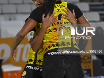 Eduarda Santos Lisboa (L) and  Ana Patricia Silva Ramos (R) of Brazil react during the women's Volleyball World Beach Pro Tour Finals agains...