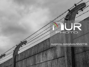 (EDITOR'S NOTE: Image was converted to black and white) Barb wired fence at the former Nazi German Auschwitz I concentration camp at Auschwi...