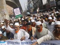 Activists of Bangladesh Khelafat Majlis take part in a protest against the burning of the holy Koran in Sweden, in Dhaka, Bangladesh on Janu...