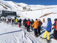 Long lines to access the chairlifts to reach the slopes in the ski and mountain resort of Alto Campoo or Branavieja which is located in the...