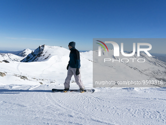 A young man practices snowboarding in the ski and mountain resort of Alto Campoo or Branavieja is located in the municipality of Hermandad d...