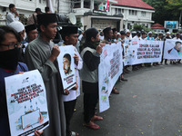 Hundreds of  Indonesian Muslims demonstrated in protest against the burning of the Koran by a Swedish politician with accompanied symbol the...