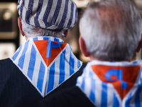 Holocaust survivors wearing striped scarves attend a ceremony during 78th Anniversary Of Auschwitz - Birkenau Liberation and Holocaust Remem...