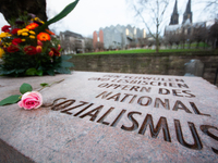 A wreath and a flower is seen placing at the monument of the memorial to gay and lesbian victims of National Socialism in Cologne, Germany o...