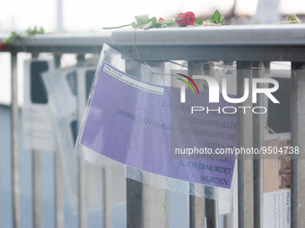 several pictures of people who were murdered during the holocaust is seen hanging on the fence of rhine river  in Cologne, Germany on Januar...