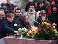 about a hundred people gather in front of  the monument of the memorial to gay and lesbian victims of National Socialism in Cologne, Germany...